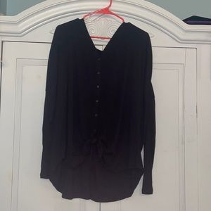 black legging shirt with tie in front. hardly worn. very good condition